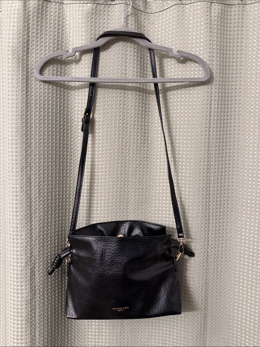 Structured Black Leather Crossbody Bag with Gold Accents